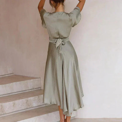 Elegant Midi Dress with Bow Detail and Flowing Skirt for Summer Days