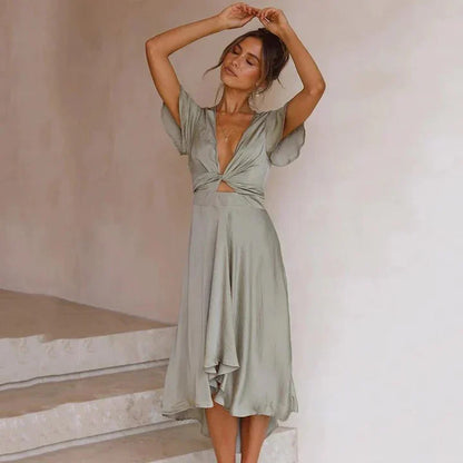Elegant Midi Dress with Bow Detail and Flowing Skirt for Summer Days