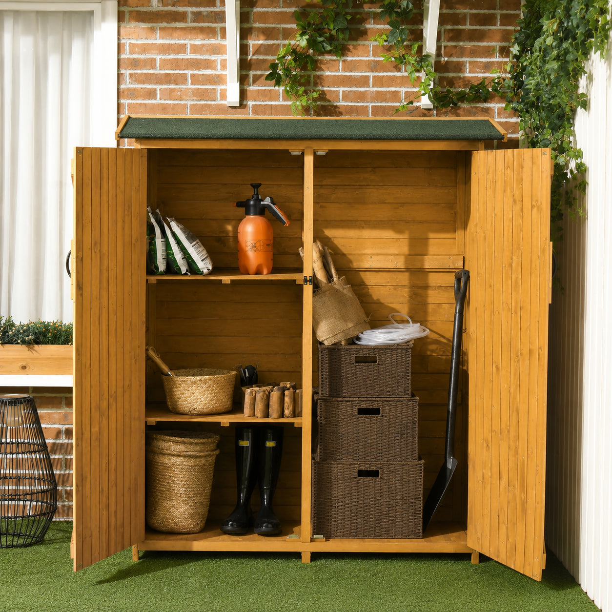 Interior shelving and tall tool compartment inside wooden storage shed