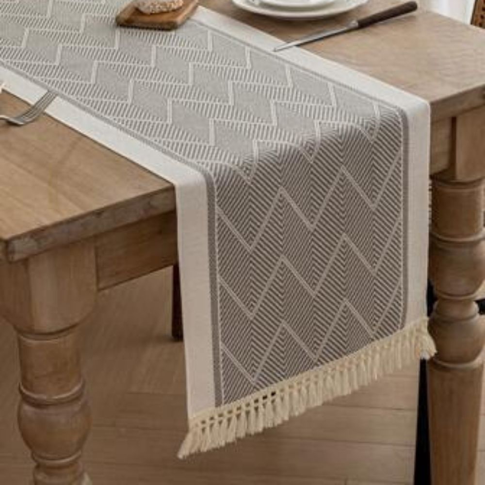 Table with Woven Runner with Zigzag Pattern and Fringes for Stylish Tables