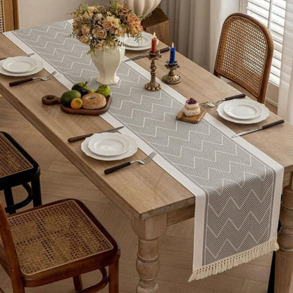 Table with Woven Runner with Zigzag Pattern and Fringes for Stylish Tables
